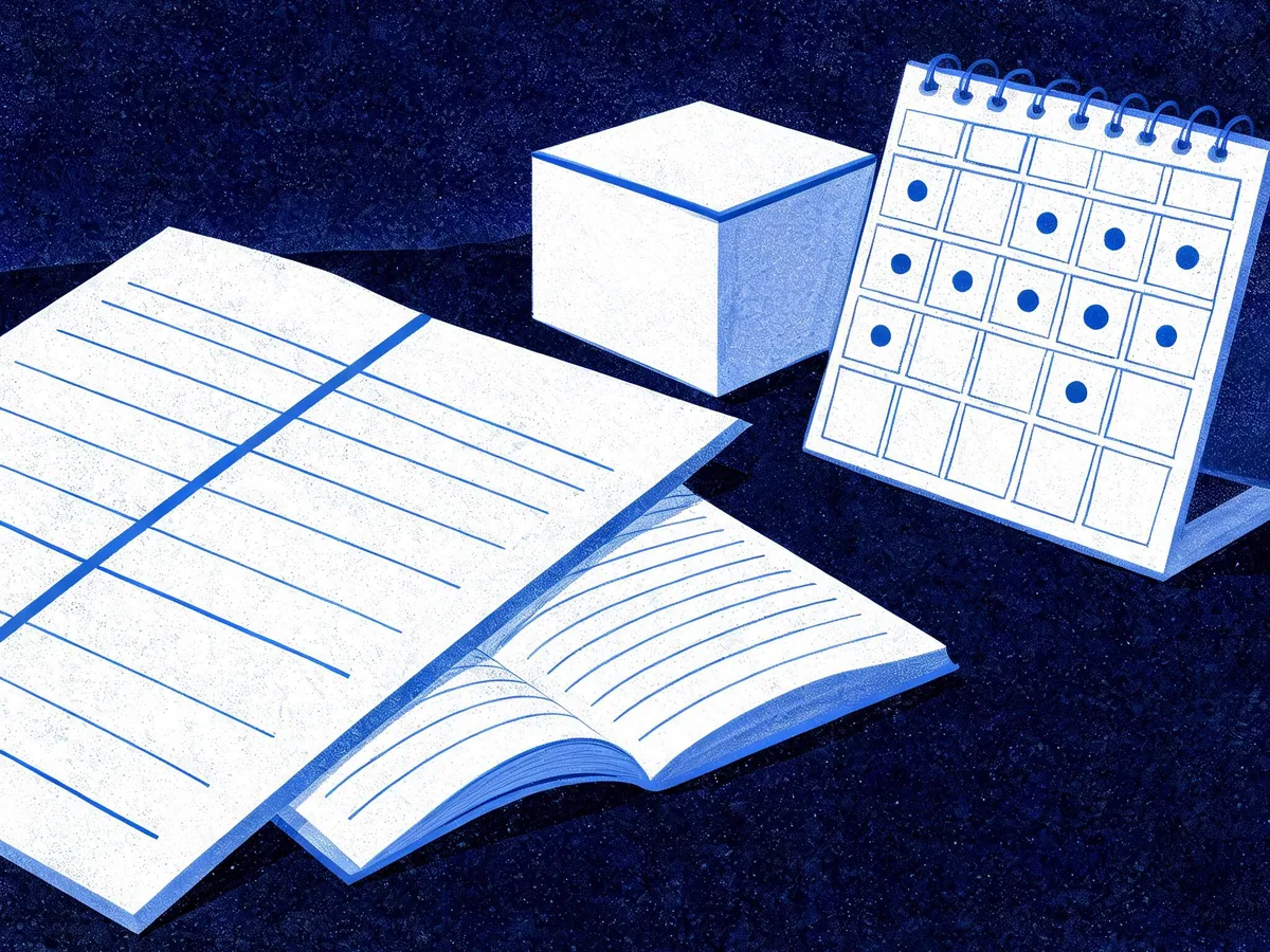 Cited — a comparison worksheet beside a laptop-free analytics notebook, product packaging, and a marked calendar on a worktable